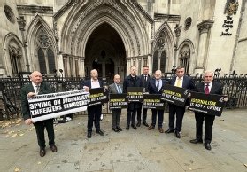 Photo of journalists Barry McCaffrey and Trevor Birney outside court with supporters