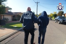 Police arresting the organiser of the Ghost encrypted messaging platform.